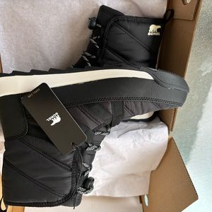 Black and white men’s shoes still in the box